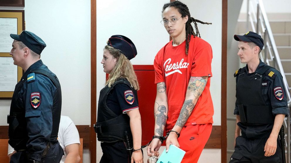 PHOTO: American professional basketball player Brittney Griner is escorted to a courtroom for a hearing in Khimki, Russia, outside Moscow, on July 7, 2022. 