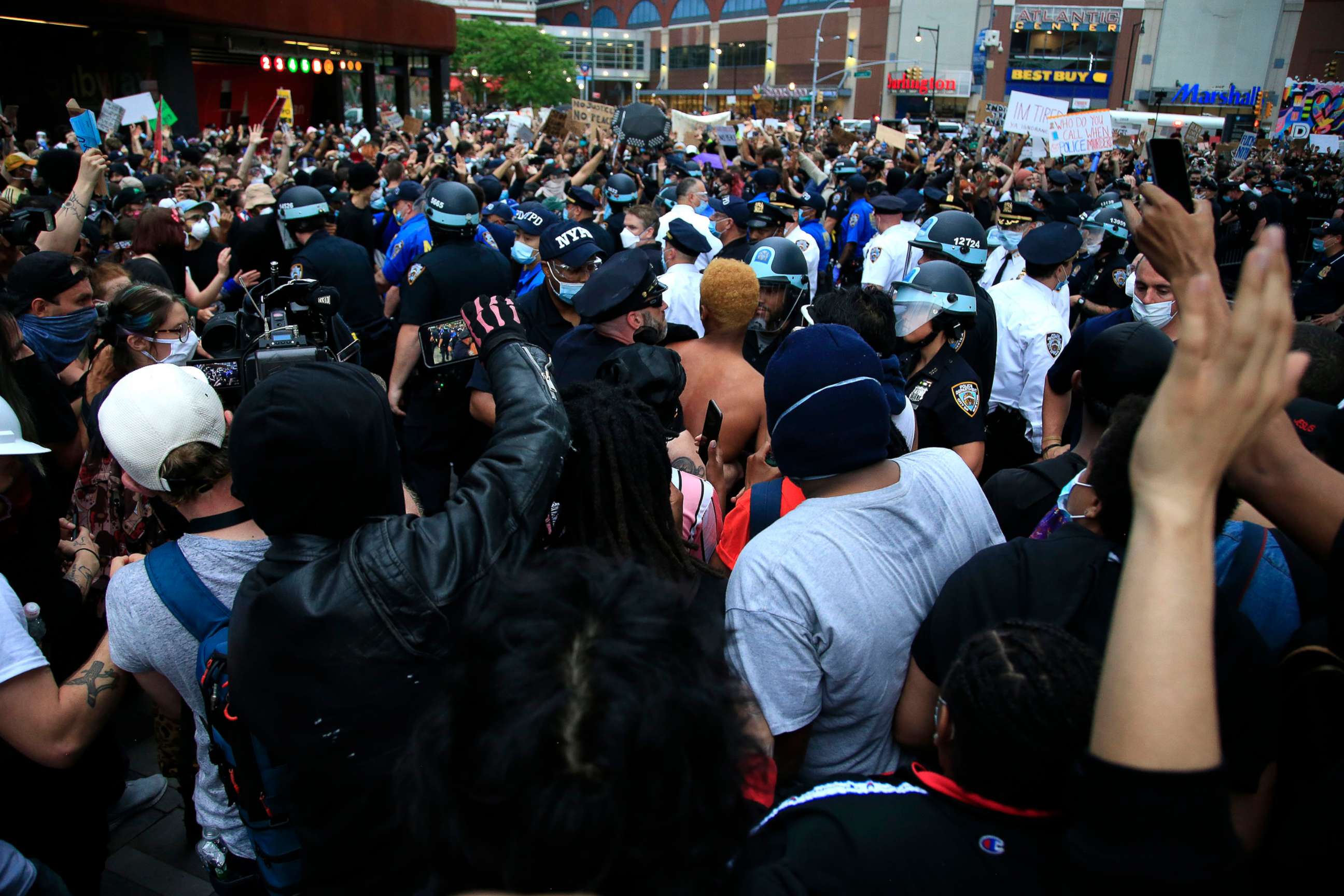 PHOTO: New York Police Department officers gather as activists hold a rally in response to the police killing George Floyd in front of Barclays Center on May 29, 2020, in the Brooklyn borough of New York.