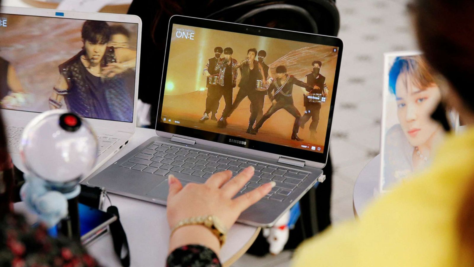 FILE PHOTO: Fans of K-pop idol boy band BTS watch a live streaming online concert at a cafe in Seoul, South Korea, on Oct. 10, 2020.