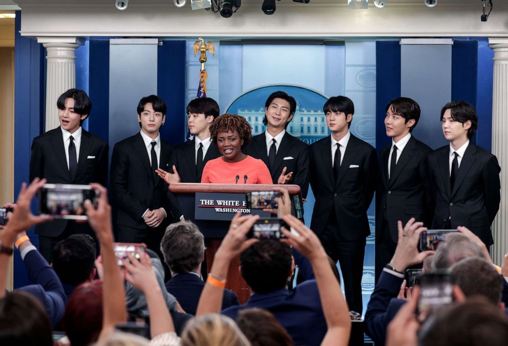 PHOTO: White House Press Secretary Karine Jean-Pierre welcomes members of the South Korean pop group BTS to the daily press briefing at the White House on May 31, 2022 in Washington, DC.