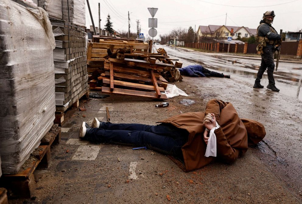 PHOTO: A body of a man with hands bound by white cloth and a bullet wound to the head, who according to residents was shot by Russian soldiers, lies in the street in Bucha, Ukraine on April 3, 2022.
