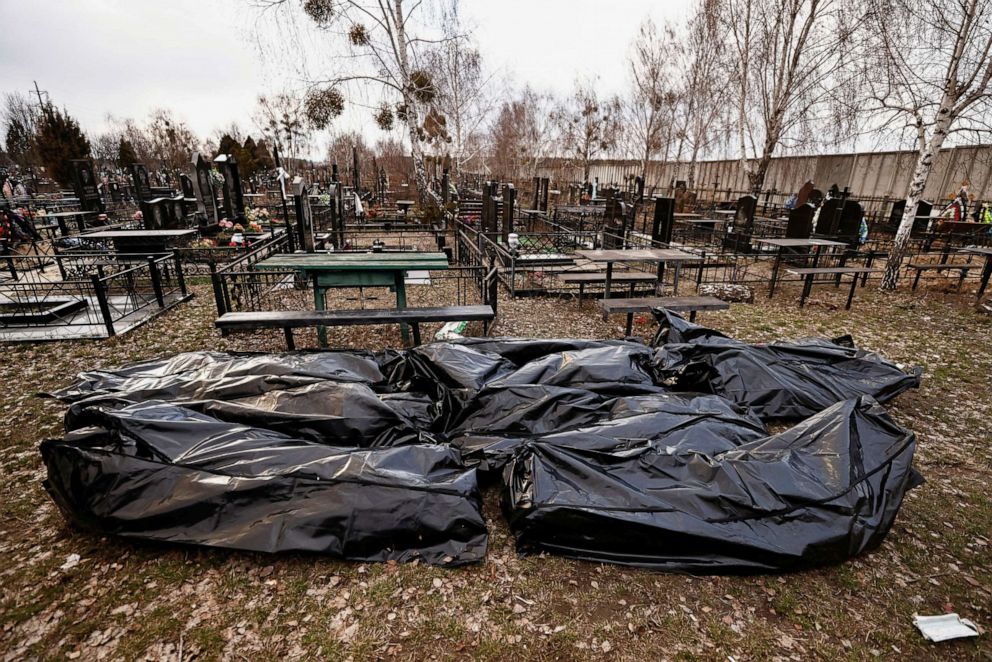 PHOTO: Bags containing bodies of civilians are seen at the cemetery after being picked up from the streets before they are taken to the morgue, amid Russias invasion of Ukraine, in Bucha, Ukraine April 4, 2022.