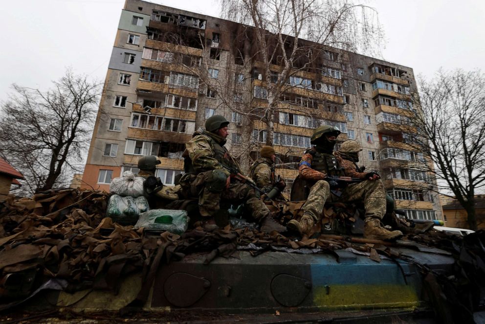 PHOTO: Ukrainian soldiers are pictured on their military vehicle, amid Russia's invasion on Ukraine in Bucha, Ukraine, April 2, 2022.