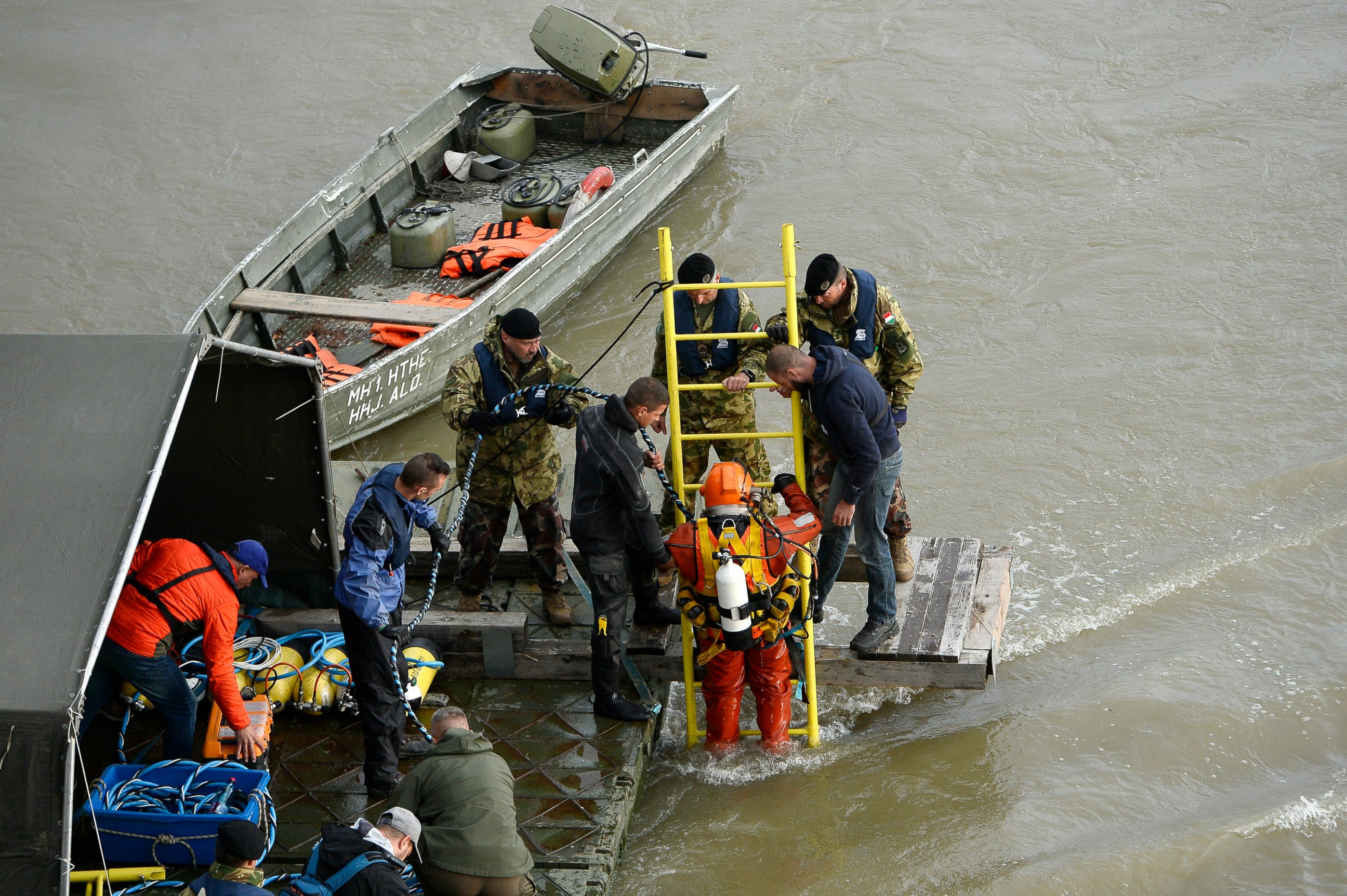 PHOTO: A diver descends a ladder to dive to the wreckage as rescuers work to prepare the recovery of the capsized boat under Margaret Bridge in Budapest, Hungary, Thursday, May 30, 2019, after a sightseeing boat collided with a large river cruise ship.