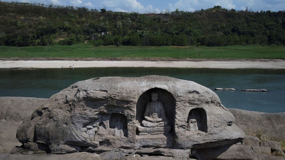 PHOTO: A once submerged Buddhist statue sits on top of Foyeliang island reef in the Yangtze river, which appeared after water levels fell due to a regional drought in Chongqing, China, August 20, 2022.