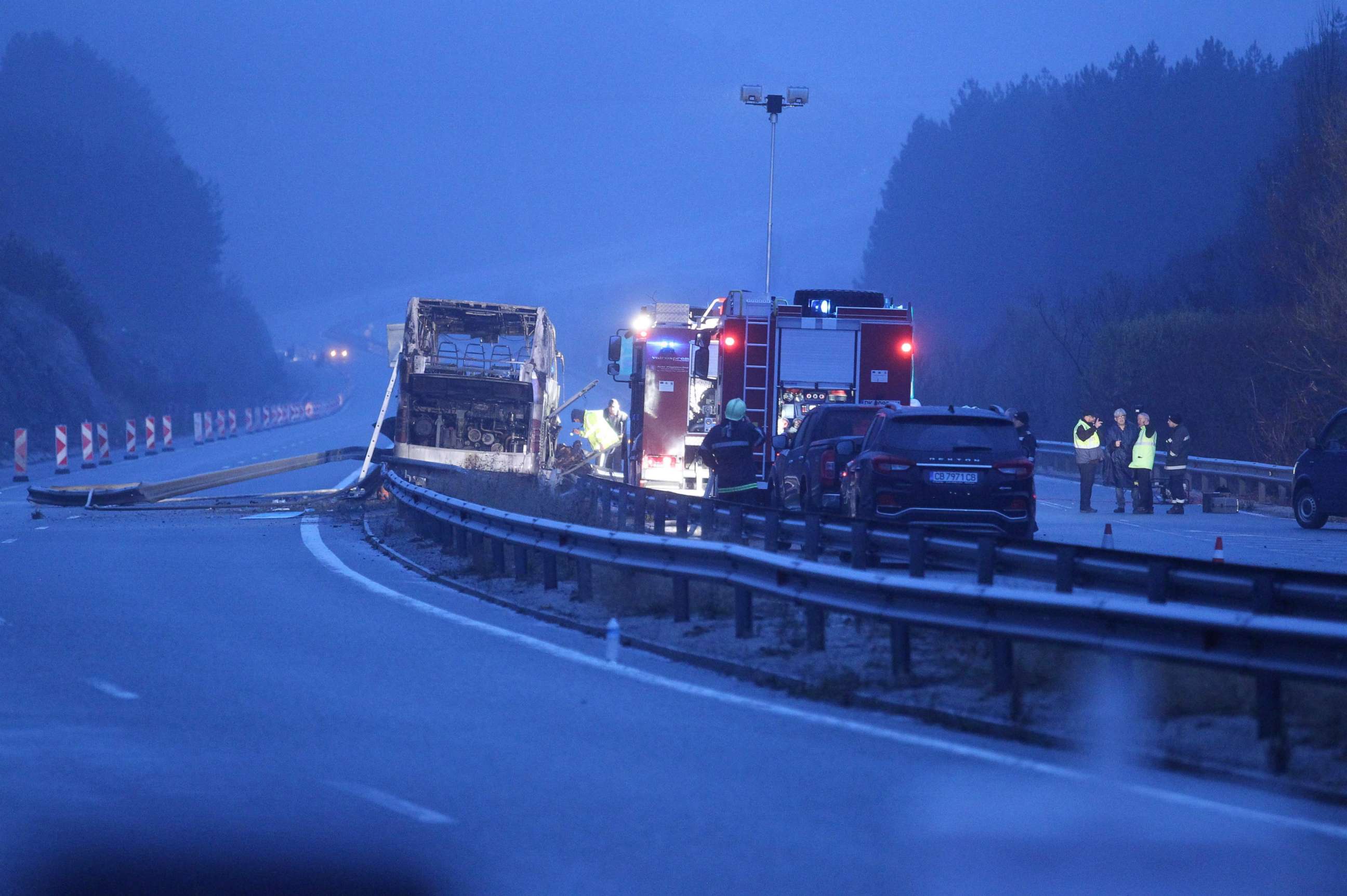 PHOTO: Officials work at the site of a bus accident, in which dozens of people were killed, on a highway near the village of Bosnek, about 25 miles southwest of Sofia, Bulgaria, on Nov. 23, 2021.