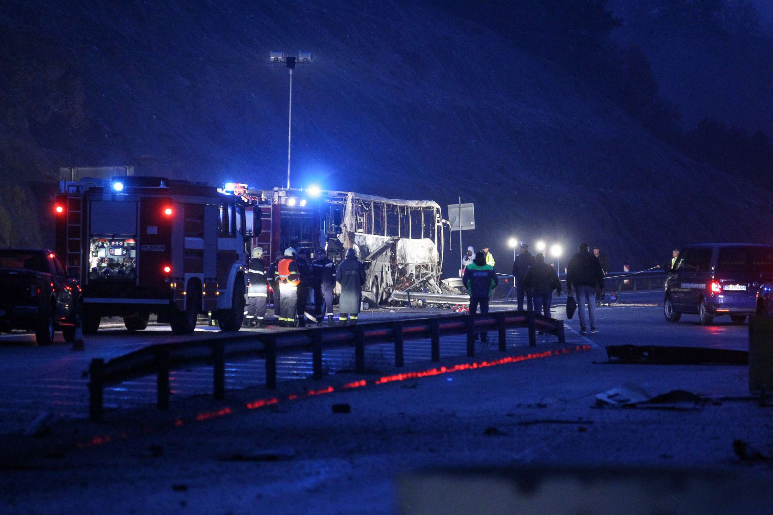 PHOTO: Officials work at the site of a bus accident, in which dozens of people were killed, on a highway near the village of Bosnek, about 25 miles southwest of Sofia, Bulgaria, on Nov. 23, 2021.