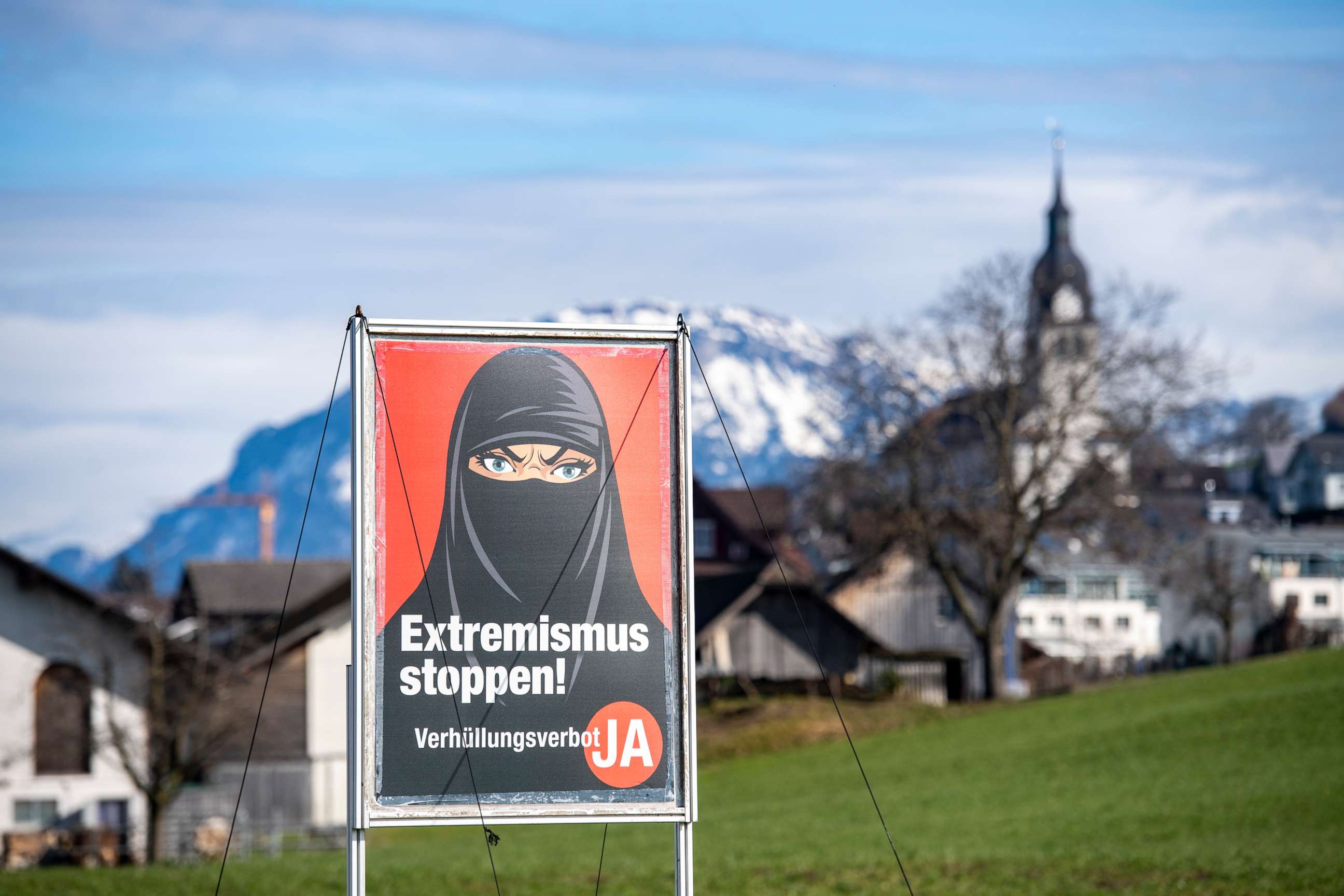 PHOTO: A poster supporting the initiative "Yes to a ban on covering the face" is displayed at the village of Buochs, Switzerland, on Feb. 16, 2021.