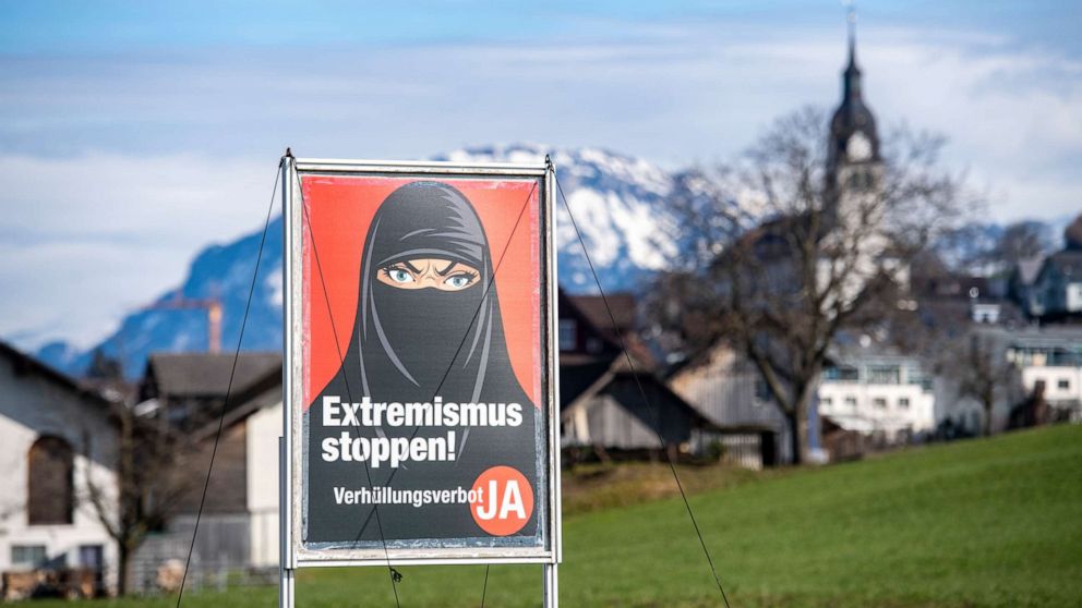 PHOTO: A poster supporting the initiative "Yes to a ban on covering the face" is displayed at the village of Buochs, Switzerland, on Feb. 16, 2021.