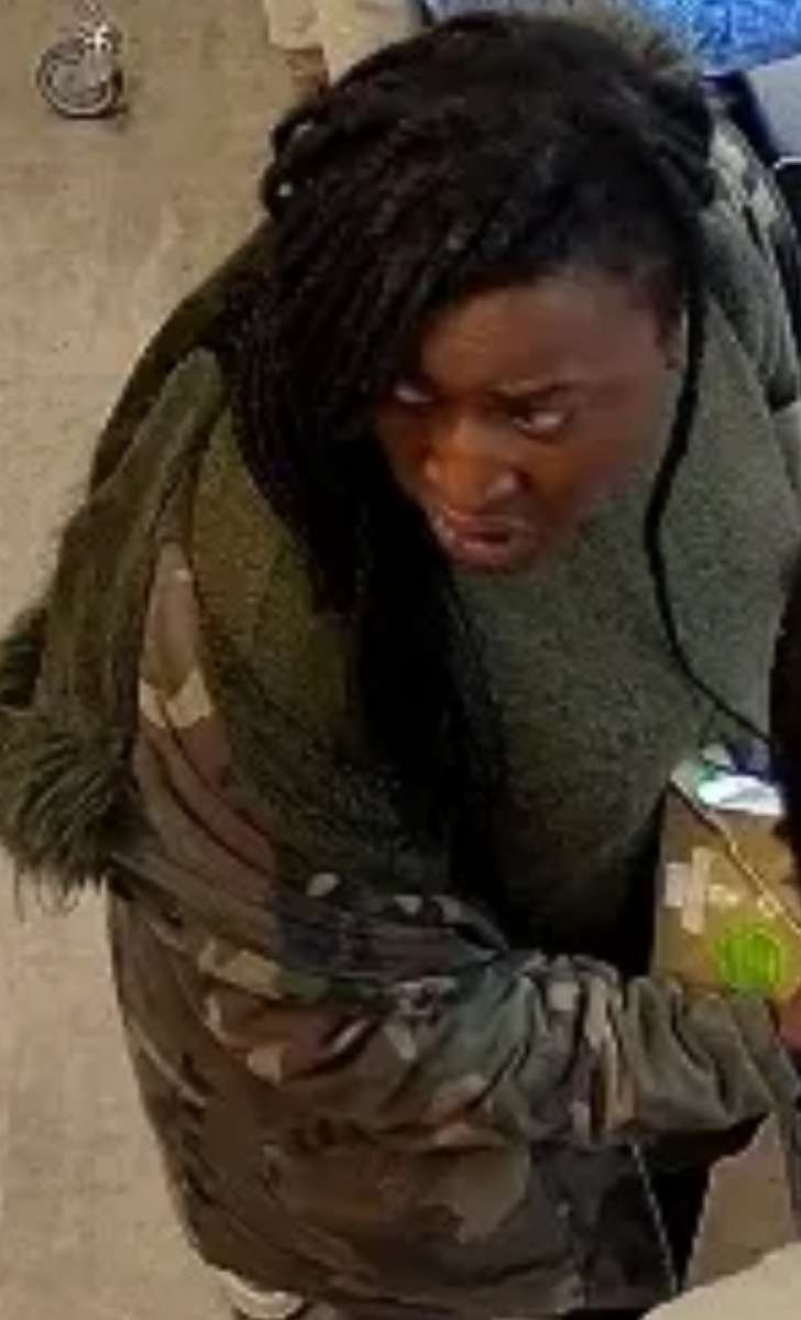 PHOTO:  A woman is seen in CCTV footage shoving another woman off a sidewalk and into the path of an oncoming bus, London, May 29, 2018.
