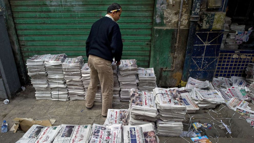 PHOTO: An Egyptian man sorts newspapers at a distribution center just off Tahrir Square in Cairo, Egypt, Dec. 2, 2011.