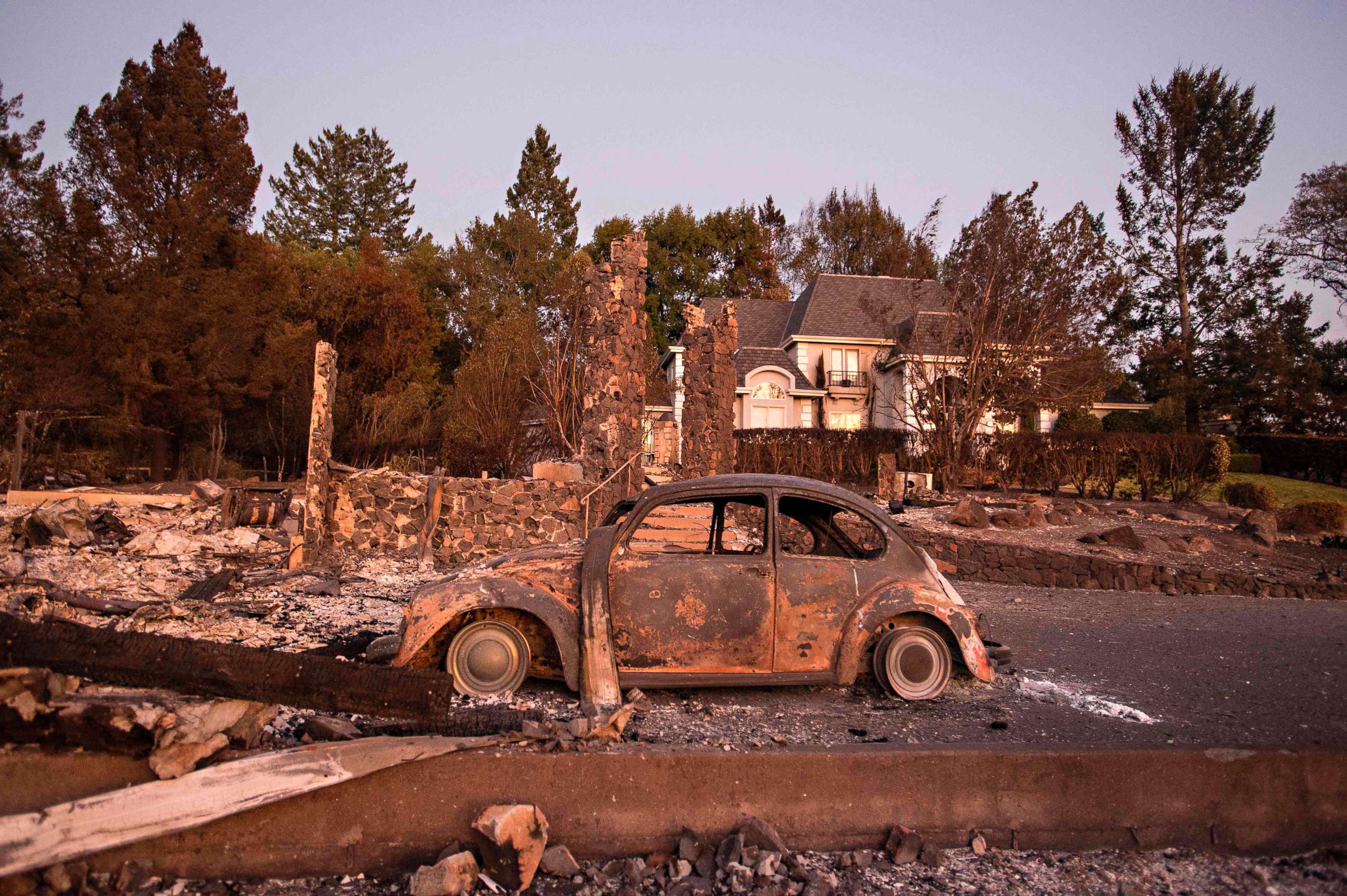 PHOTO: Charred property is seen near a home untouched by the fire in Santa Rosa, Calif. on Oct. 15, 2017. 