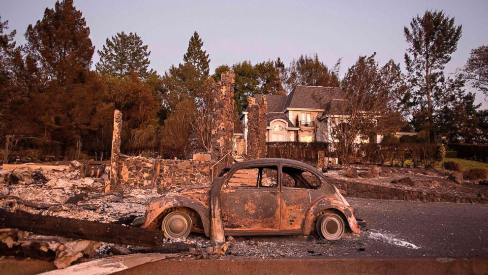 PHOTO: Charred property is seen near a home untouched by the fire in Santa Rosa, Calif. on Oct. 15, 2017. 