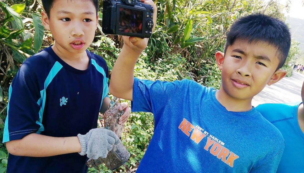 PHOTO: A school boy displays the camera which washed up on a beach in Ilan County, northeast Taiwan, March 27, 2018. 