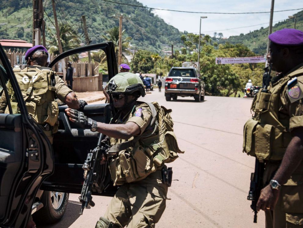 PHOTO: Members of the presidential guard rush to join the departure of the convoy of Cameroons incumbent President Paul Biya and his wife Chantal as they departed from a polling station after voting in Cameroons presidential election, Oct. 7, 2018.