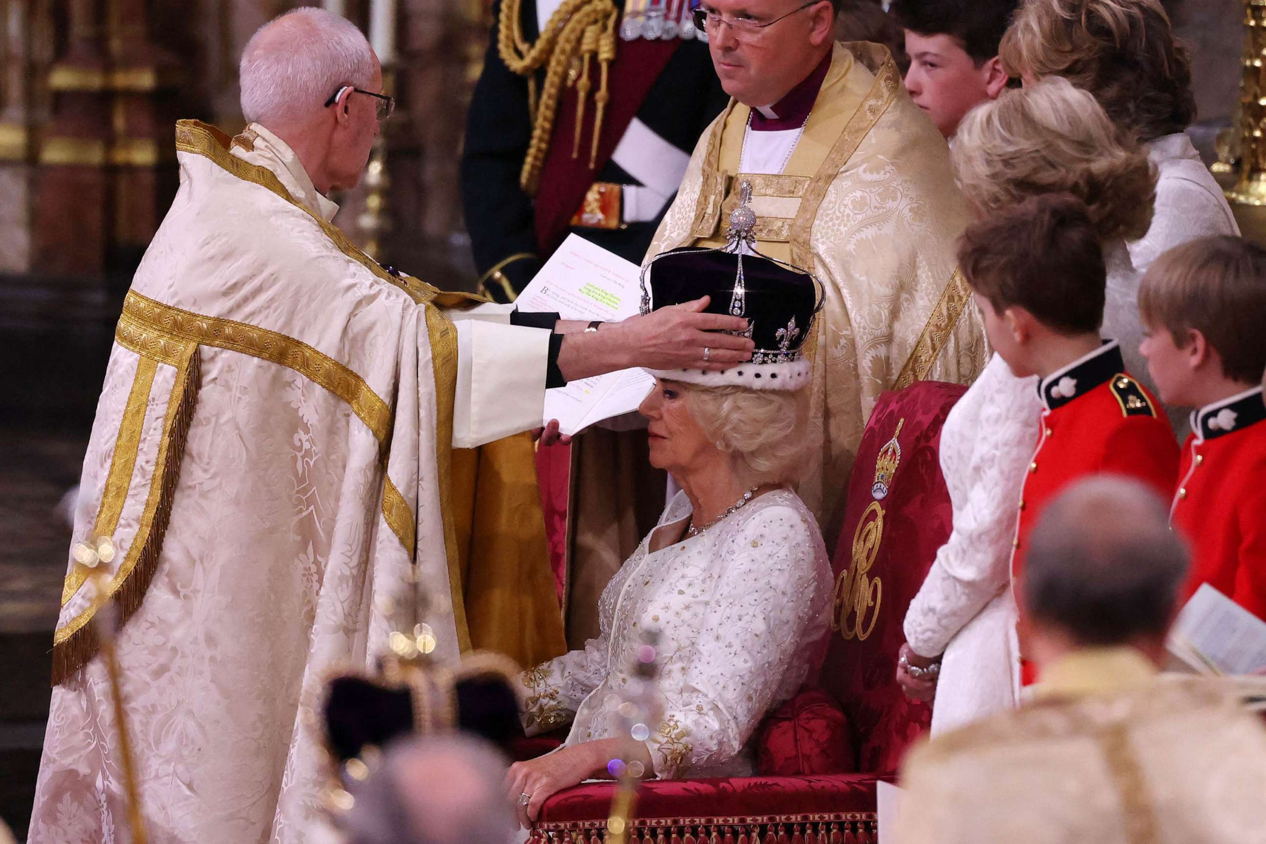 PHOTO: The Archbishop of Canterbury Justin Welby places a modified version of Queen Mary's Crown onto the head of Britain's Camilla, Queen Consort during the Coronation Ceremony inside Westminster Abbey in central London, May 6, 2023