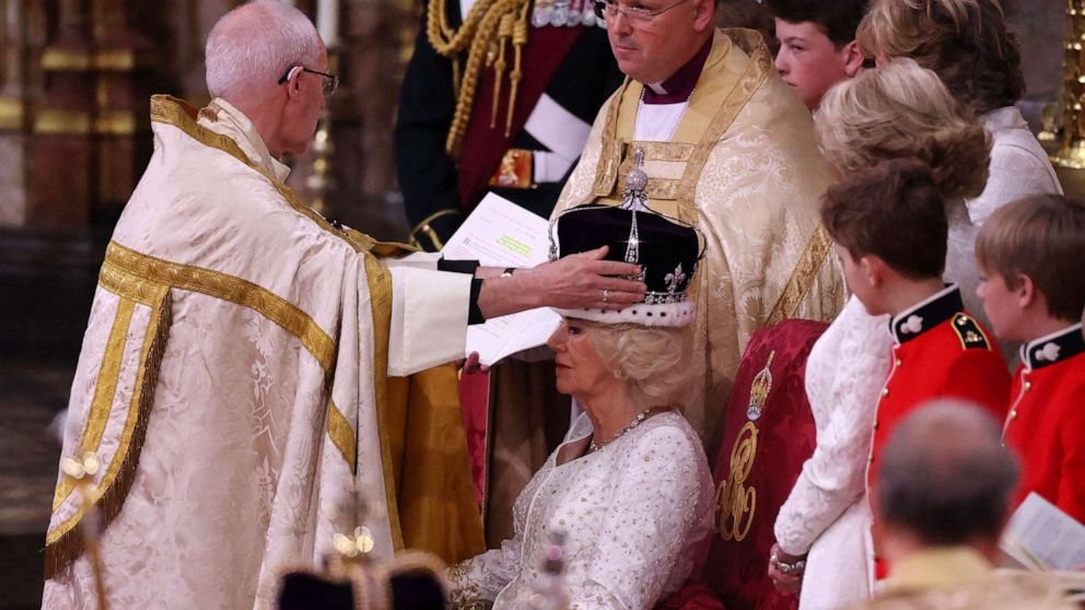 PHOTO: The Archbishop of Canterbury Justin Welby places a modified version of Queen Mary's Crown onto the head of Britain's Camilla, Queen Consort during the Coronation Ceremony inside Westminster Abbey in central London, May 6, 2023