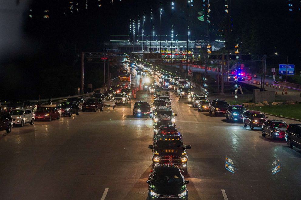 Travelers line up to enter Canada after border restrictions were loosened to allow fully vaccinated U.S. residents,following an unprecedented 16-month ban due to COVID-19, at the Thousand Islands Bridge crossing in Lansdowne, Ontario, Canada, Aug 9, 2021.