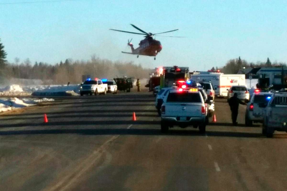 PHOTO: This image provided by 650 CKOM/980 CJME shows emergency crews responding to the scene where a bus carrying a junior hockey team to a playoff game was struck by a semi, April 6, 2018, north of Tisdale, Saskatchewan, Canada.