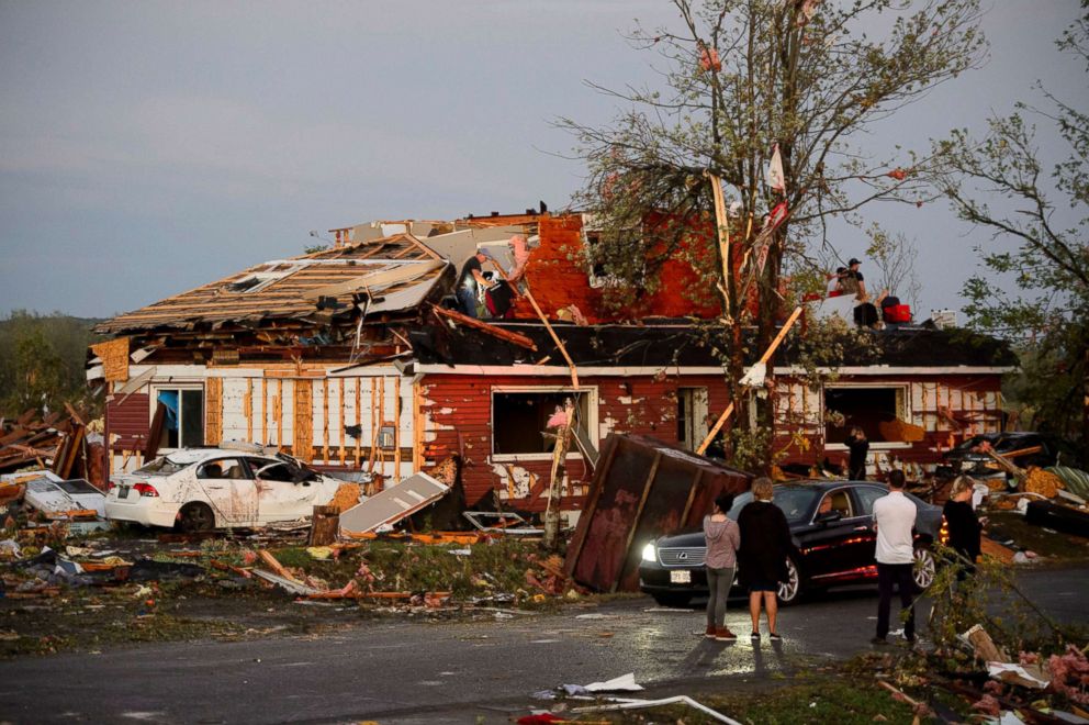 PHOTO: People collect personal effects from damaged homes following a tornado in Dunrobin, Ontario west of Ottawa, Sept. 21, 2018.