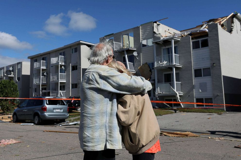 PHOTO: Residents embrace while looking at the damage after a tornado hit the Mont-Bleu neighborhood in Gatineau, Quebec, Canada, Sept. 22, 2018.