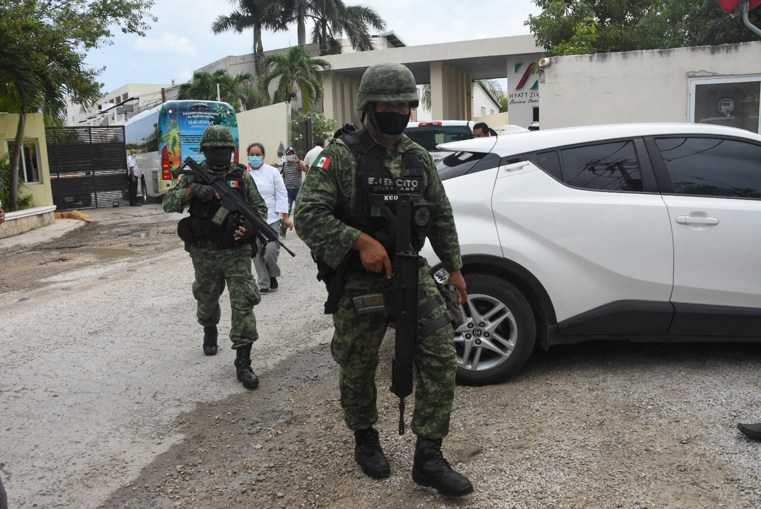 PHOTO: Mexican soldiers walk outside the Hyatt Ziva Riviera hotel in Puerto Morelos, Quintana Roo state, Mexico, on Nov. 4, 2021, after a shooting.