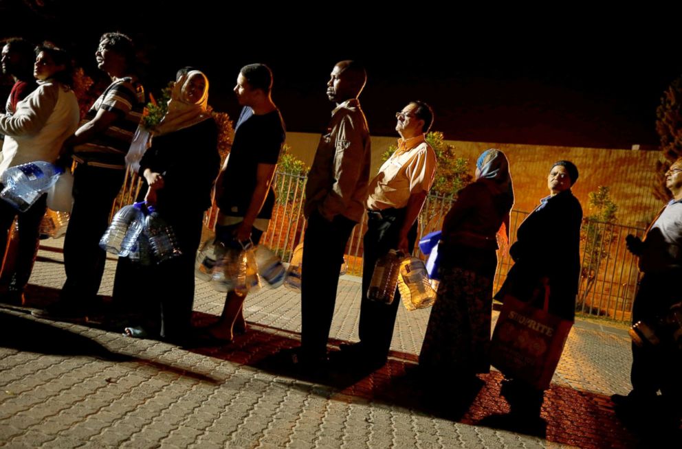 PHOTO: People queue to collect water from a spring as fears over the city's water crisis grow in Cape Town's Newlands suburb, South Africa, Jan. 25, 2018.