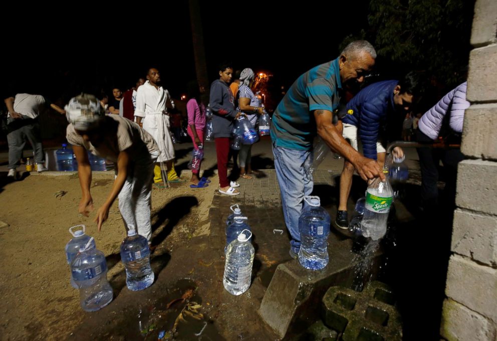 PHOTO: People queue to collect water from a spring in the Newlands suburb as fears over the city's water crisis grow in Cape Town, South Africa, Jan. 25, 2018.