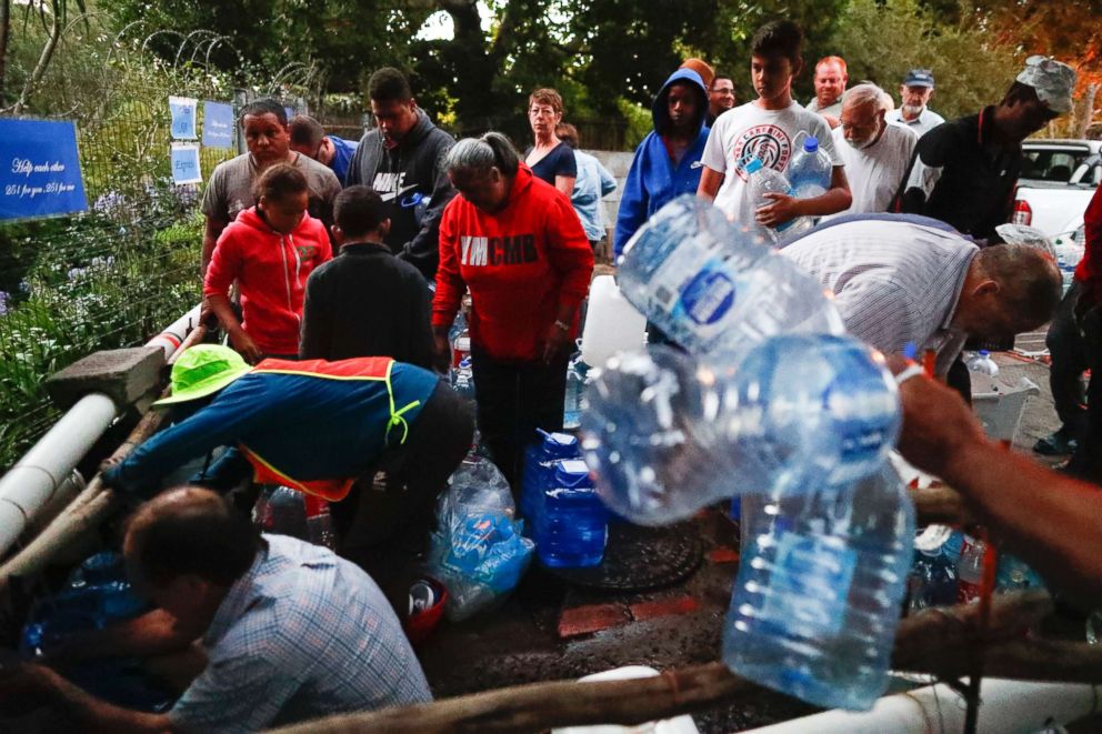 PHOTO: Residents collect drinking water from a mountain spring collection point in Cape Town, South Africa, Jan. 31, 2018.