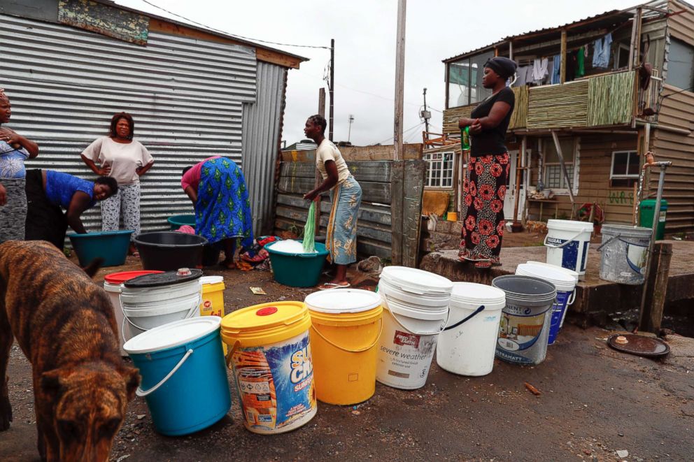 PHOTO: Residents of Masiphumelele informal settlement collect drinking water and wash clothes using water from a communal municipal tap in Cape Town, South Africa, Jan. 30, 2018. 