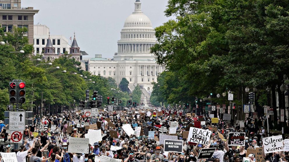 PHOTO: Demonstrators march down Pennsylvania Ave. during a protest against police brutality and racism, on June 6, 2020, in Washington.