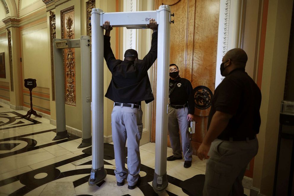PHOTO: U.S. Capitol Police install a metal detector at the doors of the House Chamber Jan. 12, 2021 in Washington, D.C.