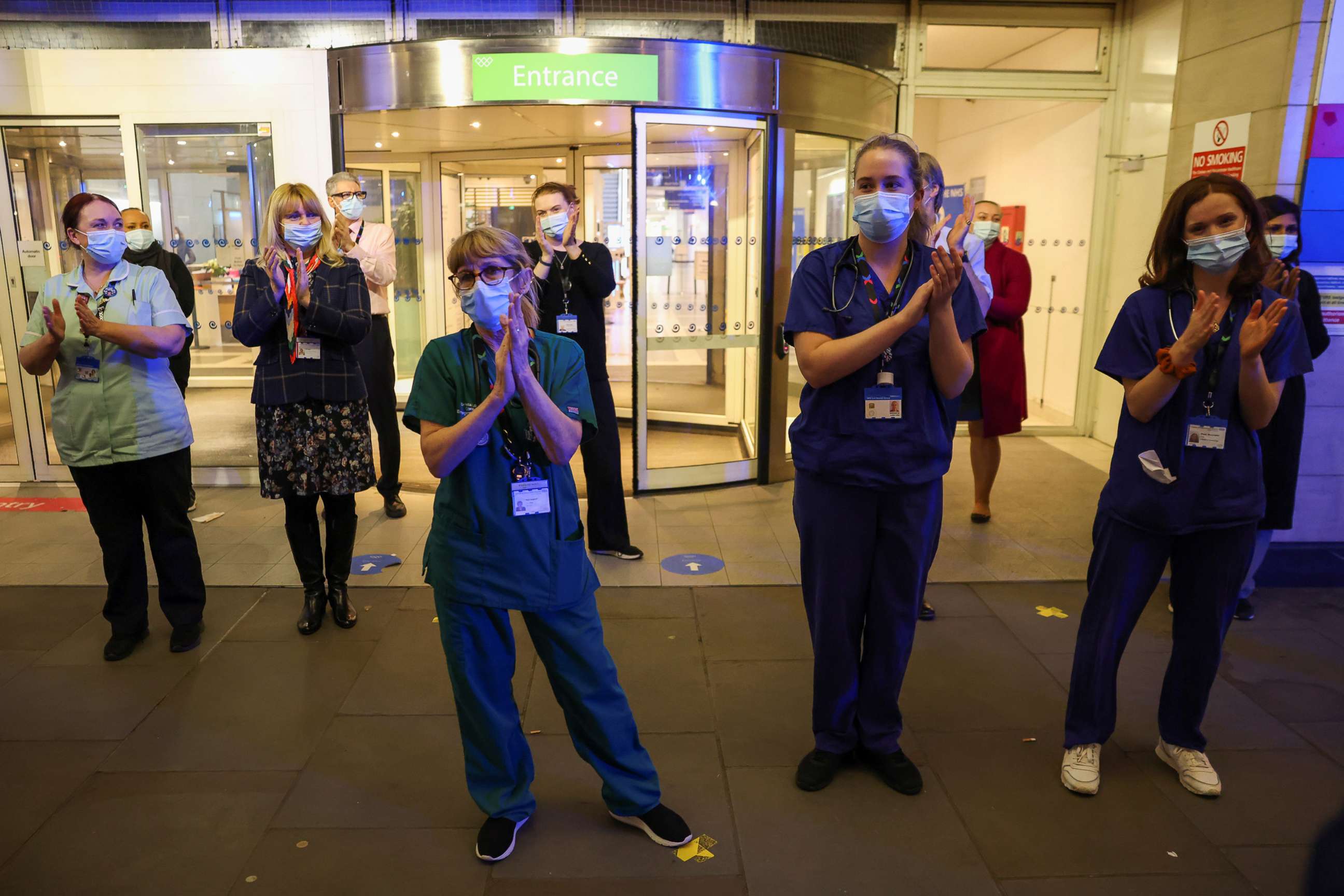 PHOTO: NHS staff participate in a national clap for late Captain Sir Tom Moore and all NHS workers, amidst the coronavirus disease (COVID-19) outbreak, at Chelsea and Westminster Hospital in London, Feb. 3, 2021.