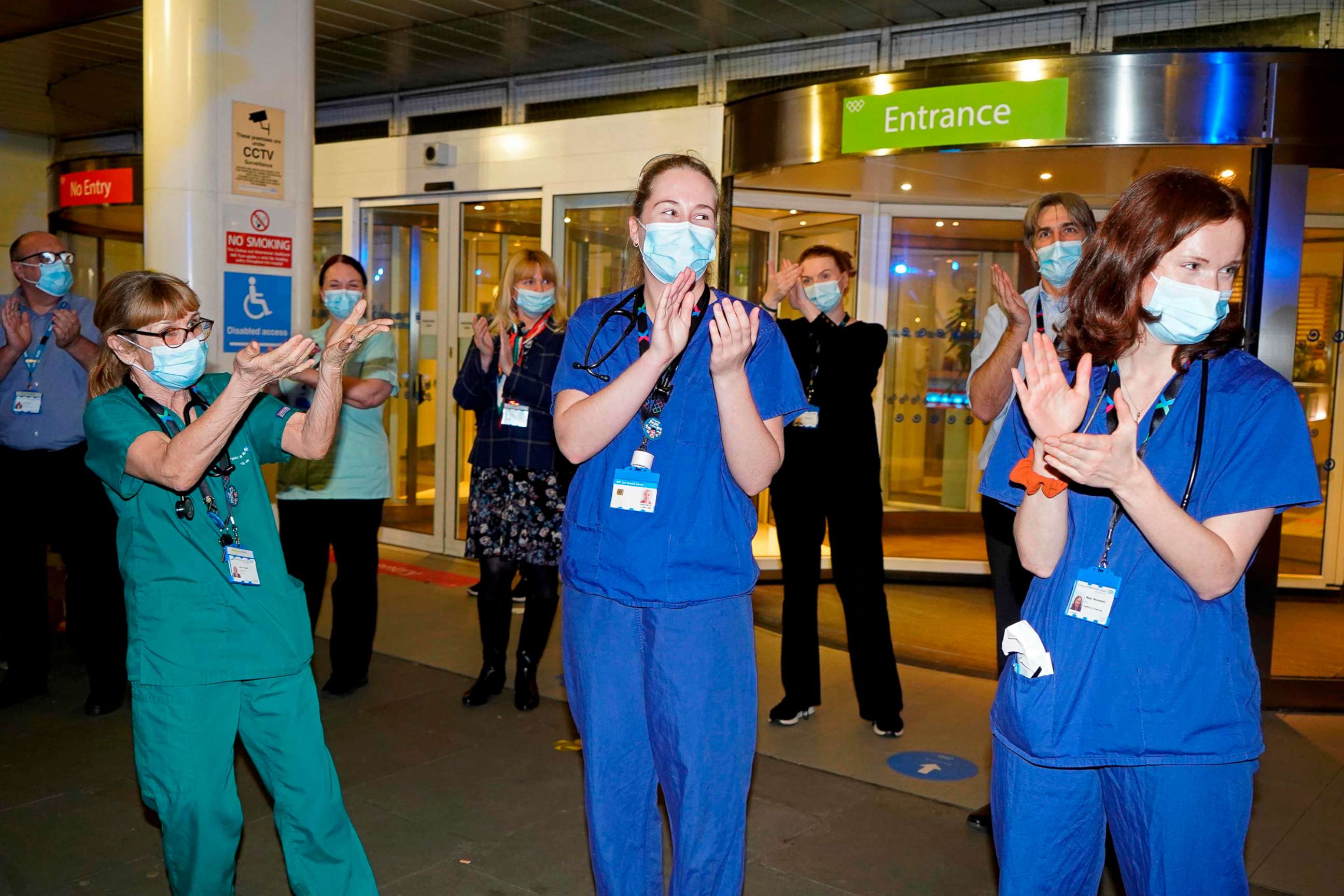 PHOTO: Members of staff at the Chelsea and Westminster Hospital take part in the Clap for Captain Tom Moore on Feb. 3, 2021 following his death and NHS staff.