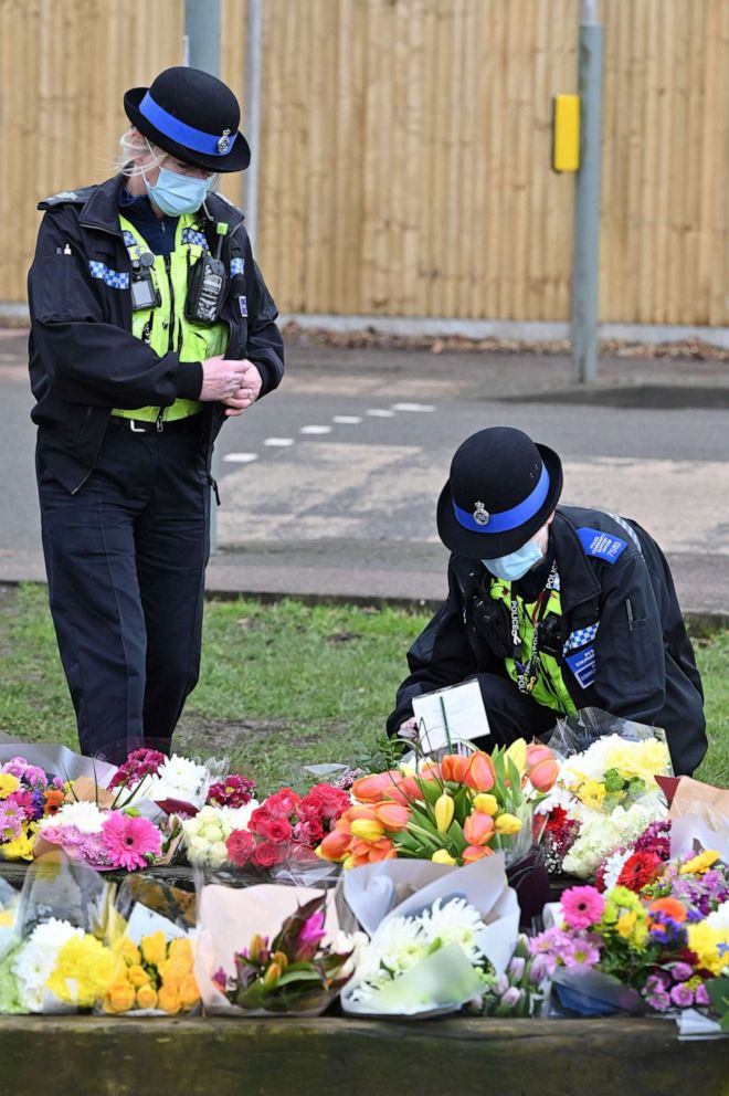 PHOTO: Community police officers lay flowers to the tributes in the village of Marston Moretaine, north of London on Feb. 3, 2021, home of the late Captain Tom Moore following his death on Feb. 2.