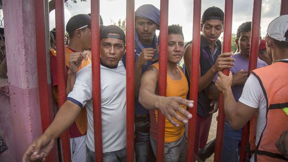 Central American migrants wait for food as they rest in the town of Nicolas Romero, in the state of Oaxaca, Mexico, April 3, 2018.