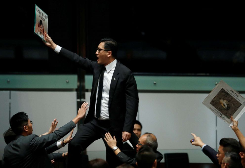 PHOTO: Lawmakers shout protests as Hong Kong Chief Executive Carrie Lam (not pictured) arrives to deliver her annual policy address, at the Legislative Council in Hong Kong, China, Oct.  16, 2019.