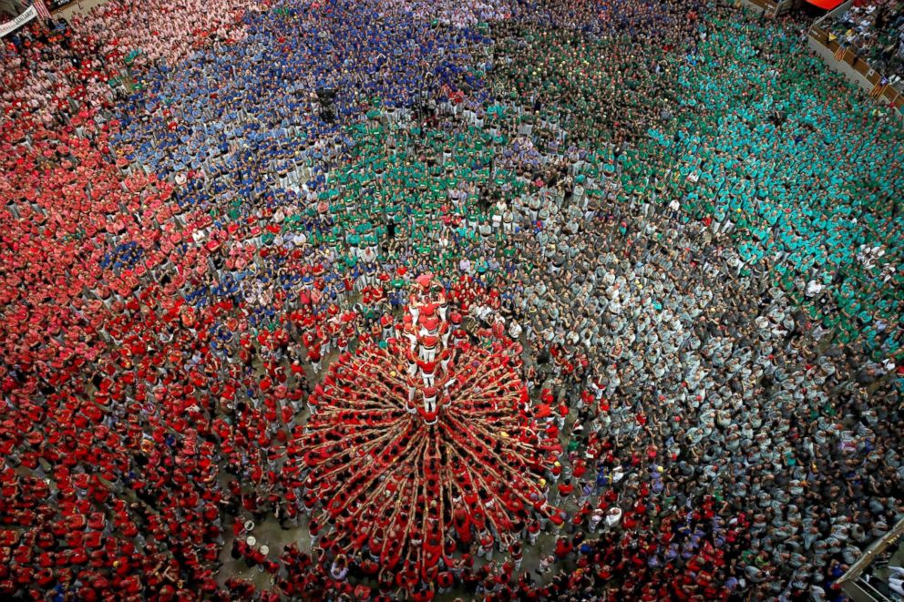 PHOTO: Members of group "Colla Joves Xiquets de Valls" form a human tower called "castell" during a biannual human tower competition in Tarragona, Spain, Oct.r 7, 2018.