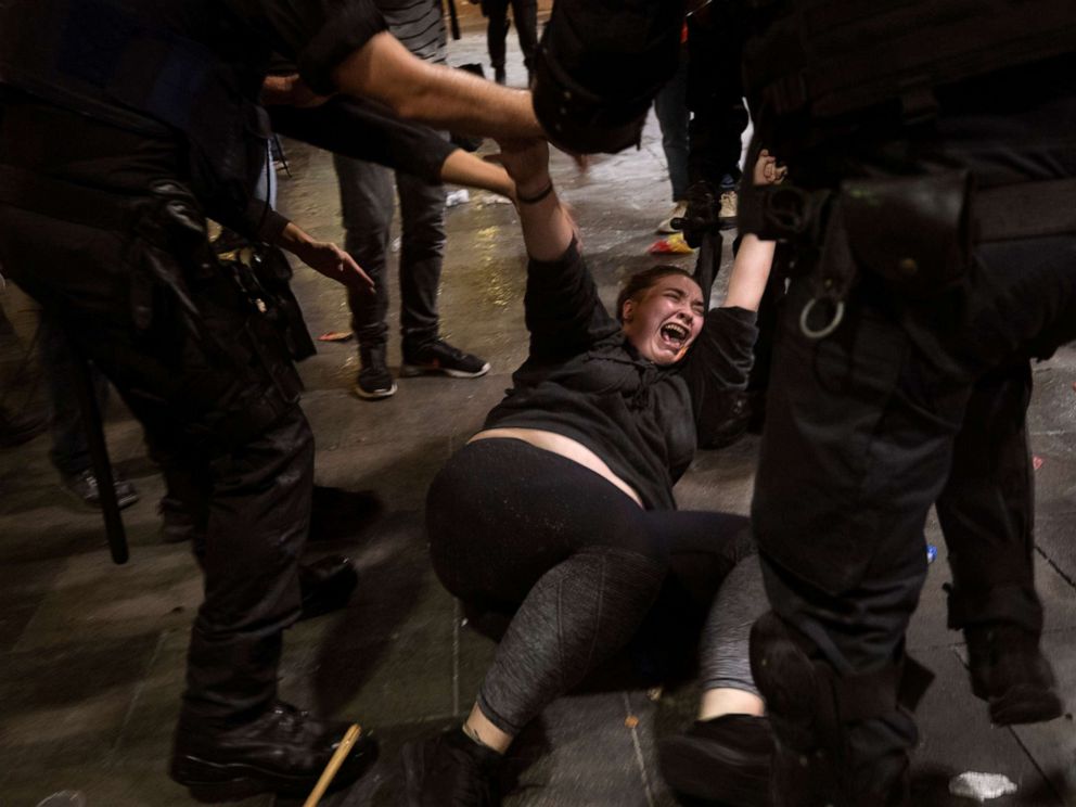 PHOTO: Police officers clash with demonstrators outside El Prat airport in Barcelona, Spain, Monday, Oct. 14, 2019.