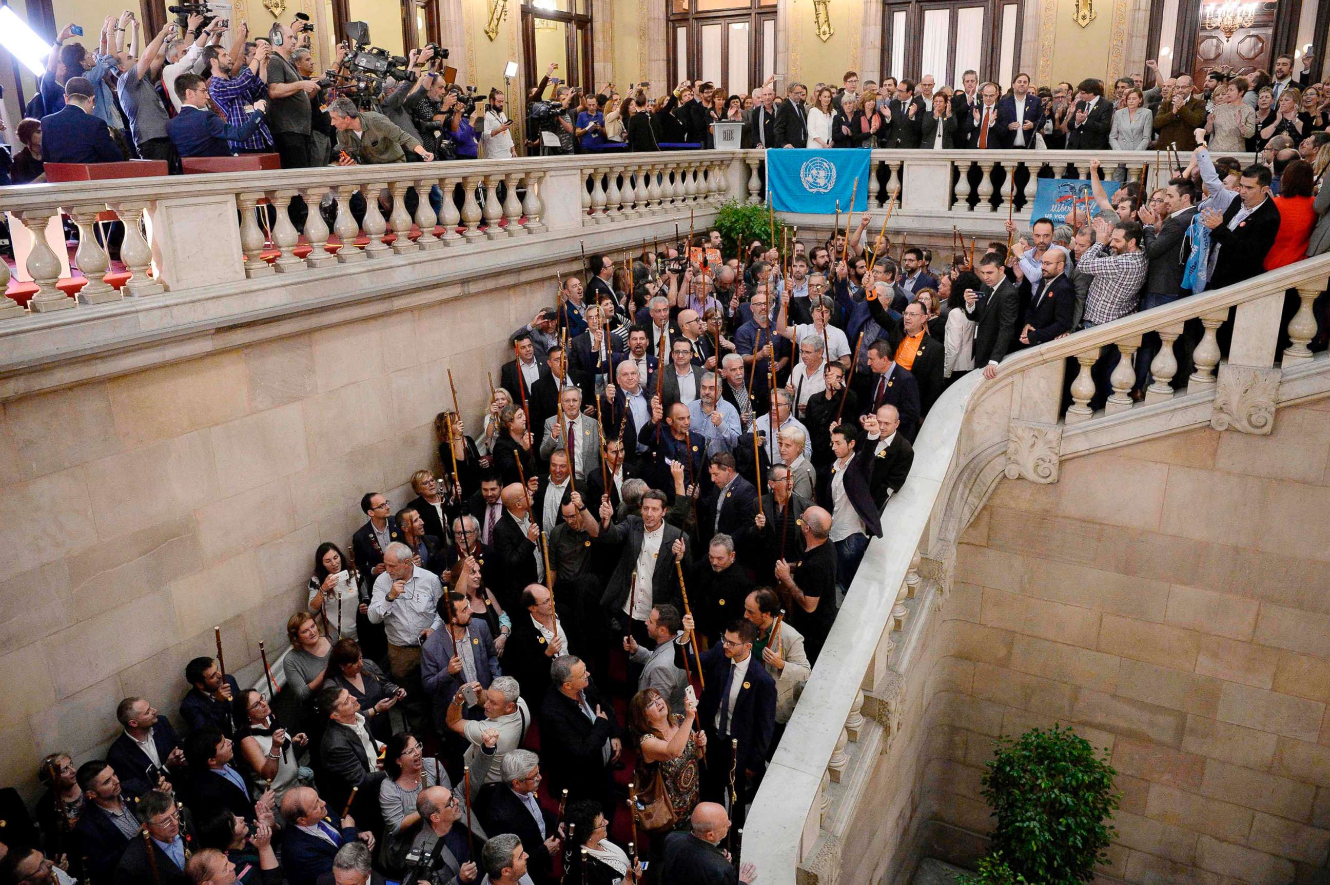 PHOTO: Catalan pro-independence mayors raise their batons after a session of the Catalan parliament in Barcelona, Spain, Oct. 27, 2017. Catalonia's parliament voted to declare independence from Spain with 70 votes in favor, 10 against and two abstentions.