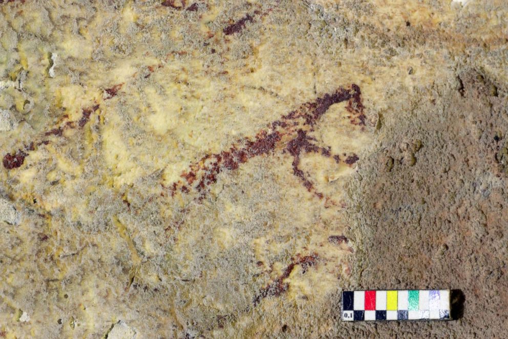 PHOTO:This handout photographreleased by Griffith University, Dec. 11, 2019, shows cave art inside Bulu Sipong 4, Sulawesi, Indonesia. The image depicts a hunting scene painted 44,000 years ago, the oldest known to date. 