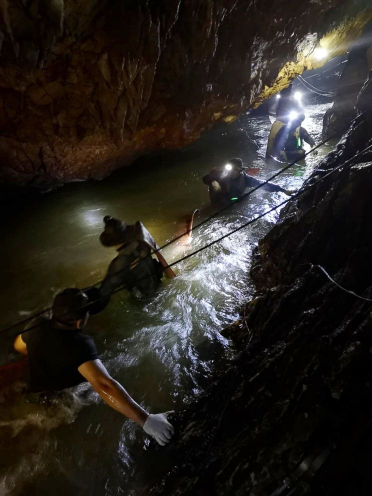 PHOTO: Divers work on a plan to rescue 12 boys and their soccer coach who remain trapped inside the Tham Luang Nang Non cave, Chiang Rai province, Thailand.