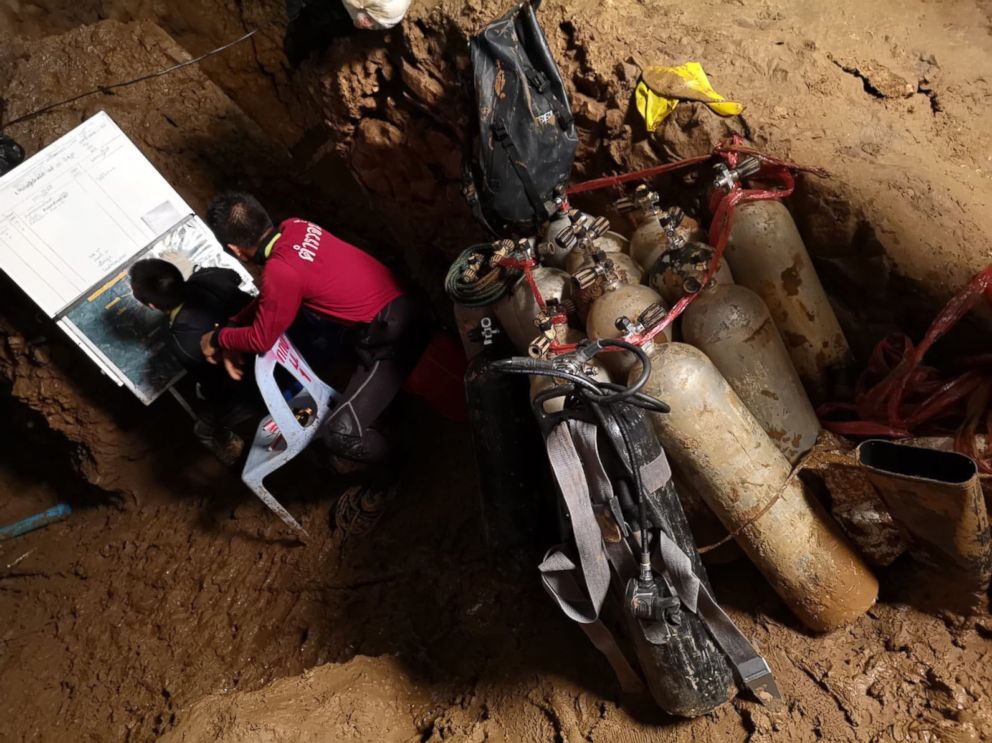 PHOTO: Rescuers work on a plan to extract 12 boys and their soccer coach trapped inside the Tham Luang Nang Non cave, Chiang Rai province, Thailand.