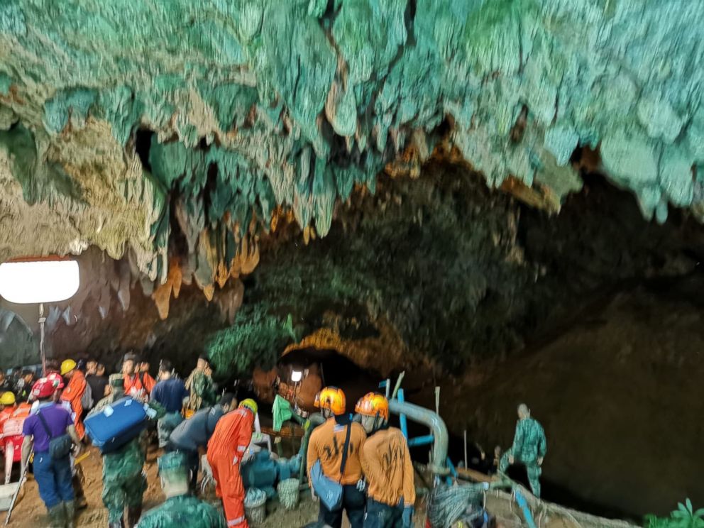 PHOTO: Rescuers work on a plan to extract 12 boys and their soccer coach trapped inside the Tham Luang Nang Non cave, Chiang Rai province, Thailand.