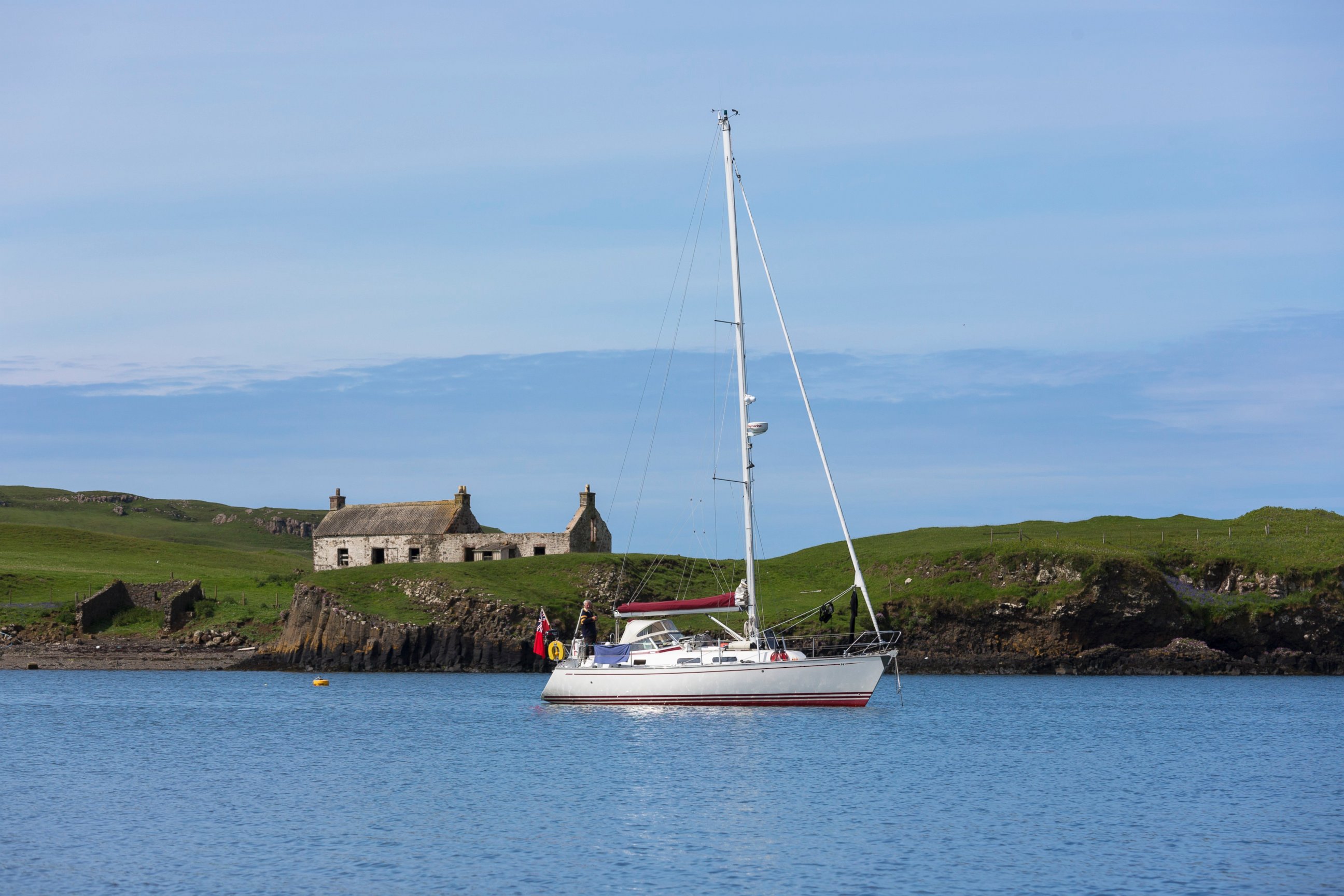 PHOTO: A boat sails past the former Catholic Church on the Isle of Canna, part of the Inner Hebrides and the Western Isles of Scotland, June 4, 2014.