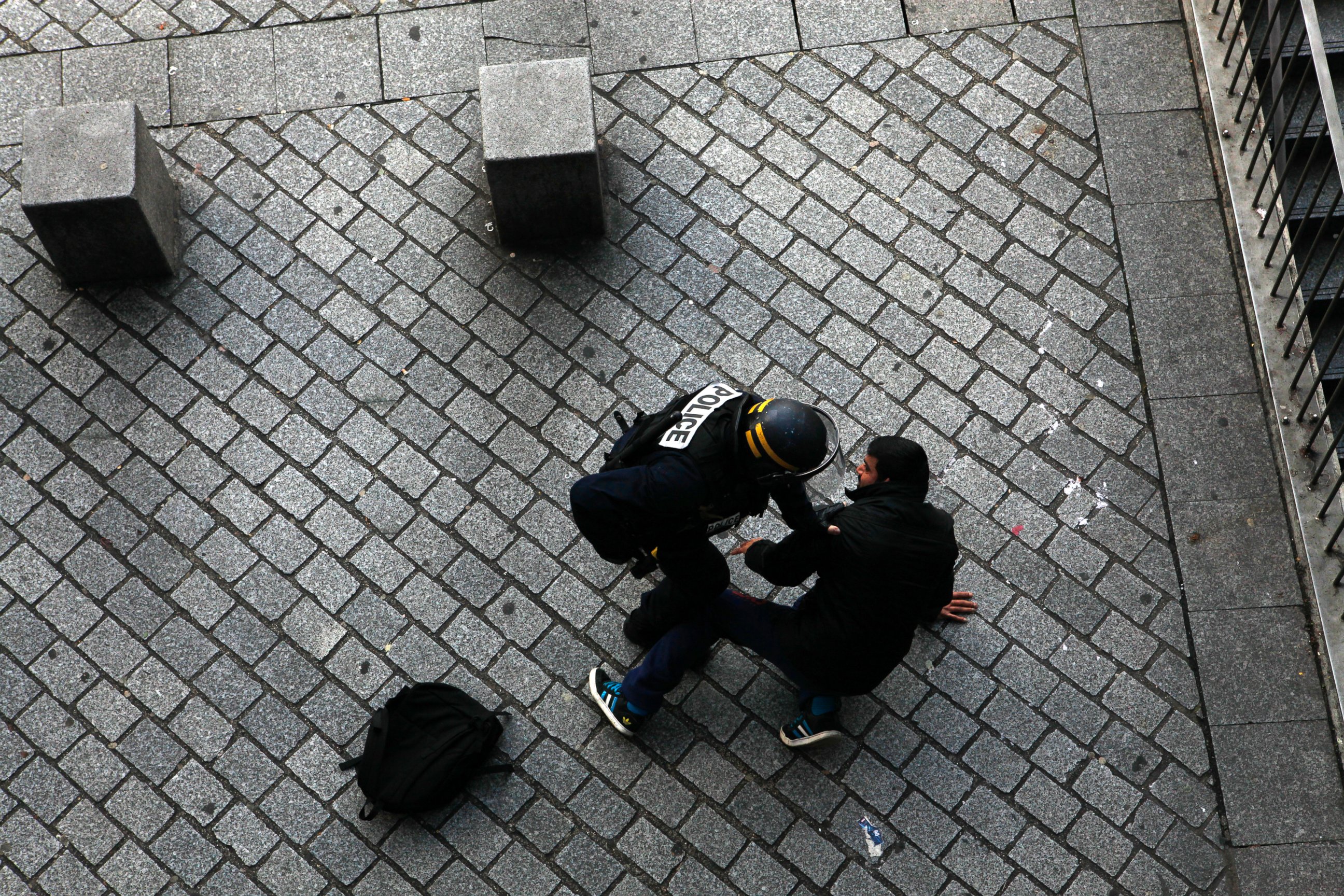 PHOTO: French police detain a man in Saint-Denis, outside Paris, in conjunction with a raid on an apartment while searching for the mastermind behind last Friday's terror attacks, Nov. 18, 2015.