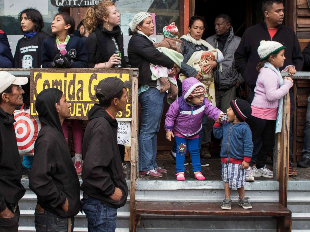 PHOTO: Central American Migrants seeking asylum in the United States await near the US-Mexico border at El Chaparral crossing in Tijuana, Mexico on May 7, 2017.
