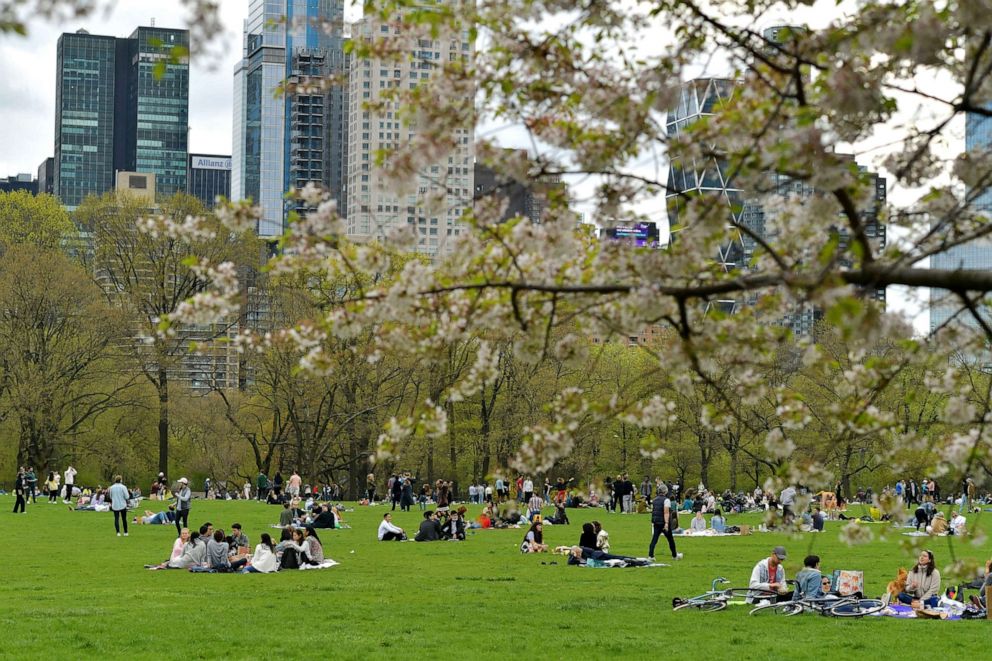 PHOTO: New Yorkers enjoy a spring day in Sheep's Meadow in Central Park, April 18, 2021, in New York City.