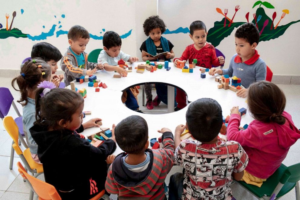 PHOTO: A group of children play with blocks during playtime at El Centro Abrazar in Bogota, Jan. 20, 2020.