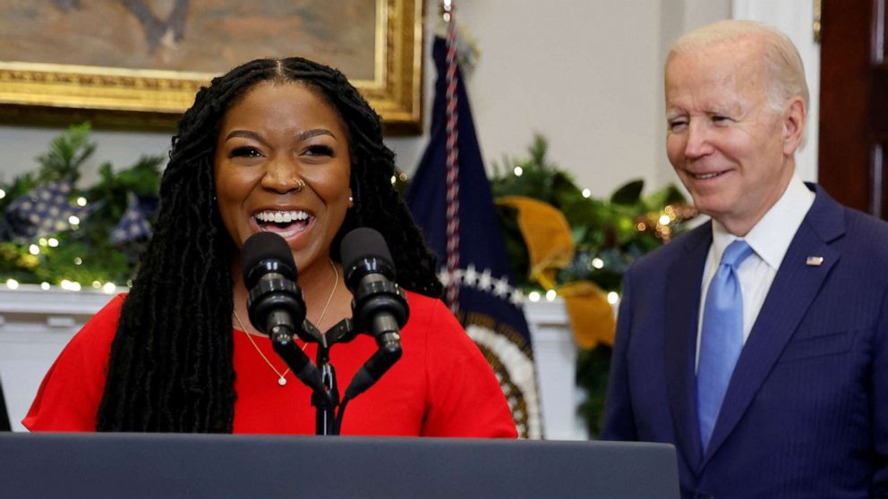 PHOTO: Cherelle Griner talks about the release by Russia of her wife, WNBA basketball star Brittney Griner, as President Joe Biden listens, in the Roosevelt Room at the White House in Washington, Dec. 8, 2022.